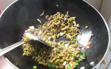 Add the sour beans and season with oyster sauce.