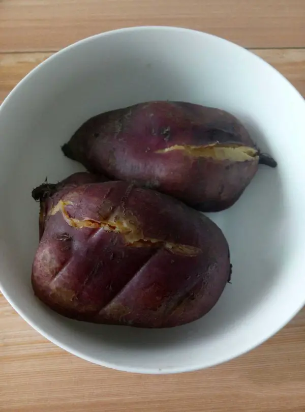 Steam the sweet potatoes in a pressure cooker