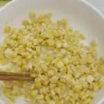 Scoop corn kernels and rinse with water.